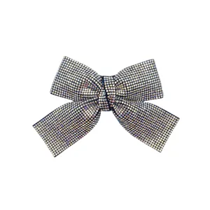 Sparkling crystal rhinestone bow hair clip detail view, full bling barrette accessory.