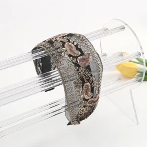 Black mesh headband with gold embroidery and pink velvet paisley details for elegant women