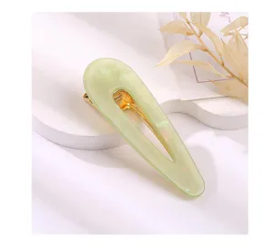 Elegant mint green acrylic teardrop hair clip with gold metal duckbill design for cute everyday wear.