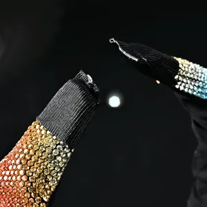 Detailed crystal pleated headband macro shot showcasing stunning gradient rhinestone details.