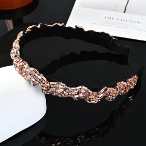 Exquisite baroque rhinestone headband with sparkling crystals and elegant black pleated design.