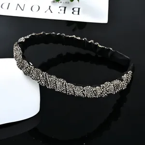 Close-up detail of the sparkling rhinestone baroque headband, showing exquisite crystal texture.