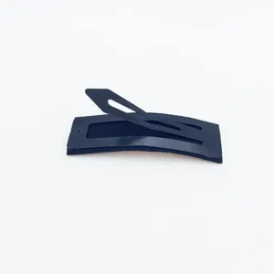 Detailed view of the black snap hair clip featuring a secure grip and sleek matte finish.