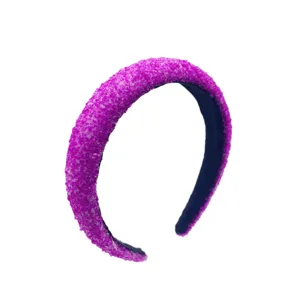 Close-up of the sparkling purple crystal wide padded headband detail texture and finish.
