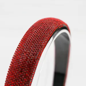 Red rhinestone headband detail close-up, sparkling crystal hair accessory for festive look