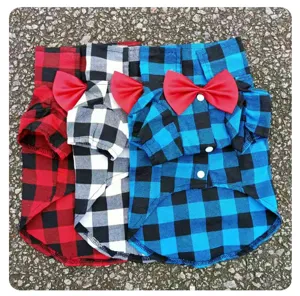 Classic plaid pet shirt detail featuring checkered fabric and red bow tie for dogs and cats.