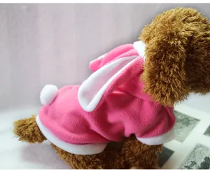 Close-up detail of cute pink fleece pet hoodie with white bunny ears and tail for dogs.