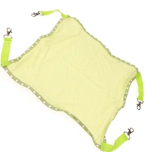 Green polka dot breathable pet hanging hammock for cats and small animals, top view display.