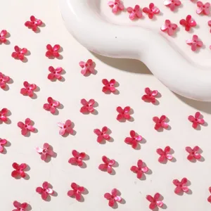 Mini jelly four-petal flower acrylic DIY charm, glossy pink sparkle for crafts and decor.