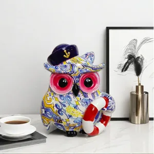 Resin nautical owl figurine with sailor hat and lifebuoy, ideal for office and room decor.