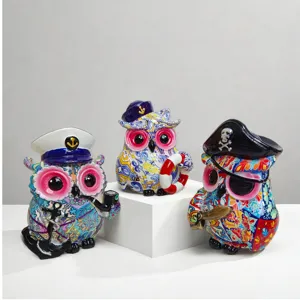 Creative pirate owl resin figurine set, colorful desktop ornament for office and study decor.