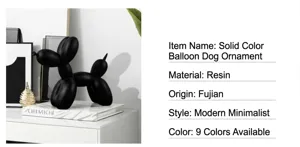 Vista detallada de escultura de perro globo de resina, decoración minimalista moderna, acabado negro.