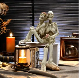 Halloween skeleton couple resin figurine ornament spooky home decor for party setup.