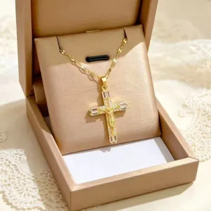 Gold cross pendant necklace featuring sparkling micro-inlaid cubic zirconia stones for women.