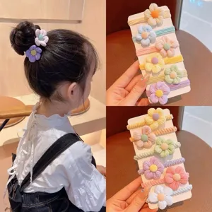 Detailed view of cute floral hair tie set for kids, high elastic fabric hair accessories.