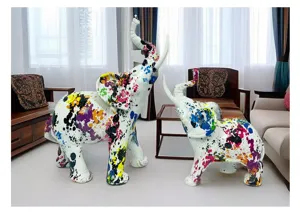 Colorful resin elephant sculptures pair, creative abstract art home decor detail view.