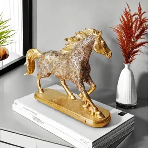 Golden horse figurine sculpture for home decor, elegant resin animal statue for living room.