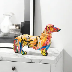 Detailed view of colorful graffiti dachshund figurine on marble tabletop, vibrant home decor piece.