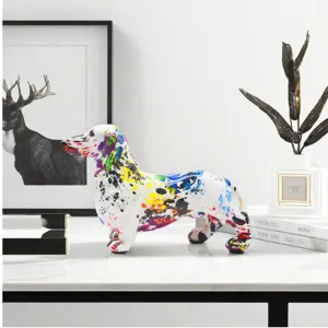 Colorful graffiti dachshund statue home decor detail view showing intricate paint splatter.