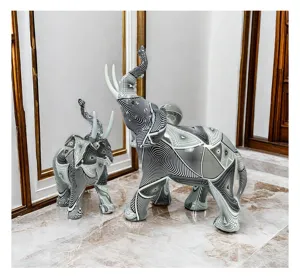 Detailed view of abstract geometric black and white resin elephant decorative ornaments.