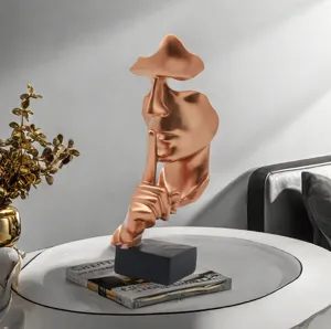 Resin abstract silence is gold face sculpture detail, modern home office desktop ornament.