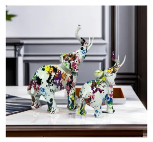 Resin elephant ornament detail, modern artistic splatter paint design, stylish home decor.