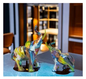 Colorful resin elephant statue detail view, creative home decor ornament for living room shelf.