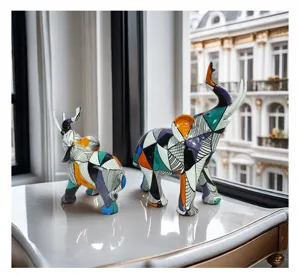 Colorful resin elephant figurine detail view, modern geometric art home decor ornament.