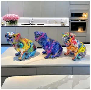 Detail view of colorful graffiti resin bulldog sculptures on modern kitchen counter decor.