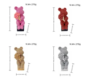 Diamond studded sitting bear figurine with bouquet, resin luxury home decor ornament.