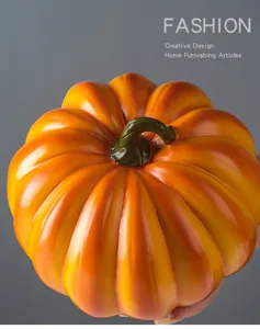 Close-up detail shot of the resin pumpkin ornament texture and vibrant gradient color finish.