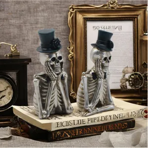 Halloween skeleton resin figurine detail shot, gothic think pose skull home decor ornament.