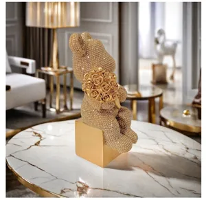 Luxury resin bear sculpture close up, glittering rhinestone gold decor for modern home living room