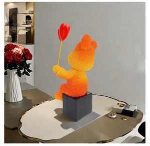 Detailed view of modern European resin bear ornament holding heart balloons for desk decor.