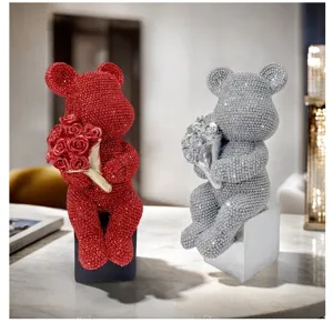 Detailed view of luxury rhinestone teddy bear figurine holding roses, modern resin home decor.