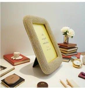 Elegant resin photo frame adorned with faux pearls, perfect for home and office desktop decor.