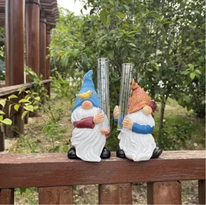 Resin garden gnome rain gauge set with glass tube for outdoor yard and patio decoration detail view.