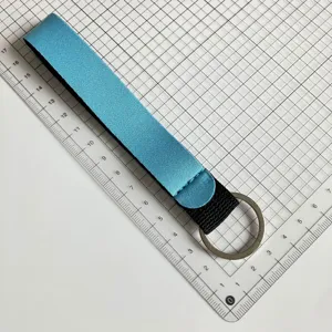 Blue black wrist strap keychain made of durable neoprene material, portable key lanyard detail.