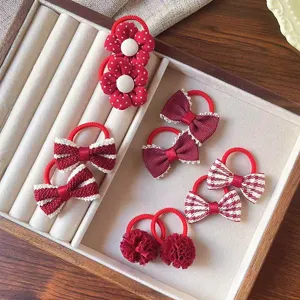 Set di elastici per capelli per bambini con fiocchi rossi, fiori e pompon morbidi.