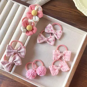 Graziosi elastici per capelli per bambini con fiocchi rosa e fiori per uso quotidiano.