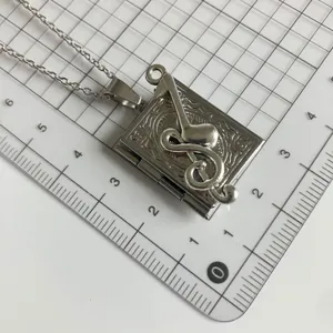 Silver music note book locket necklace pendant delicate jewelry gift for women and girls daily wear.