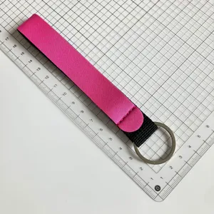 Pink neoprene wristlet keychain lanyard portable strap for keys and lipstick holders.