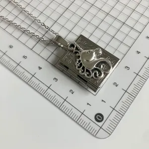 Vintage silver metal book locket necklace with detailed unicorn pendant for women and girls