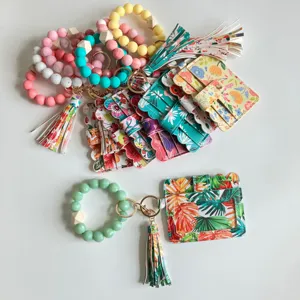 Siliconen kralen armband sleutelhanger met bloemige PU lederen houder en kwastje voor dames.