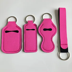 Set de soporte de neopreno para gel hidroalcohólico y un cordón llavero rosa vivo