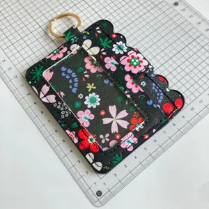 Floral pattern card holder with ID window, keychain, and cute scalloped design for daily use.