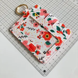 Floral pattern card holder detail view with clear window and key ring for women