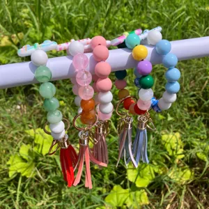 Colorful beaded wristlet keychain with PU leather tassel detail, handmade fashion accessory.