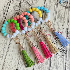 Bunte Silikon Perlen Schlüsselanhänger Armband mit stilvoller PU Leder Quaste für Damen.