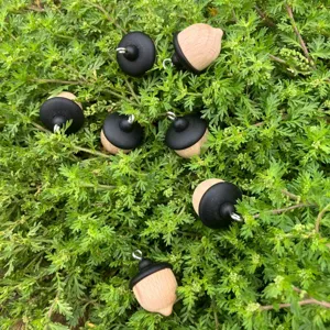 Wooden acorn pendant detail shot, natural solid wood material with metal loop, perfect for DIY.